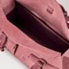 Liten Roxanne i rosa scrumpy-mocka – presenter till henne