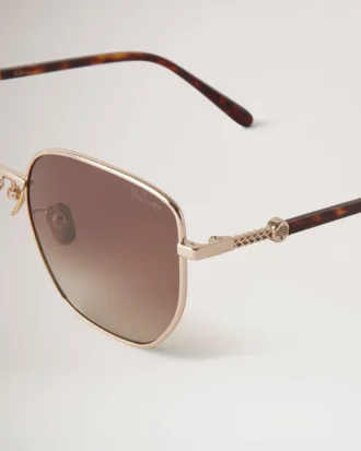 Rosie solglasögon i guld och brunt metall med linser i bio-nylon Rosie solglasögon i guld och brunt metall med linser i bio-nylon