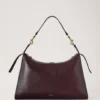 Roxanne axelväska Oxblood högblankt läder