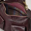 Roxanne axelväska Oxblood högblankt läder